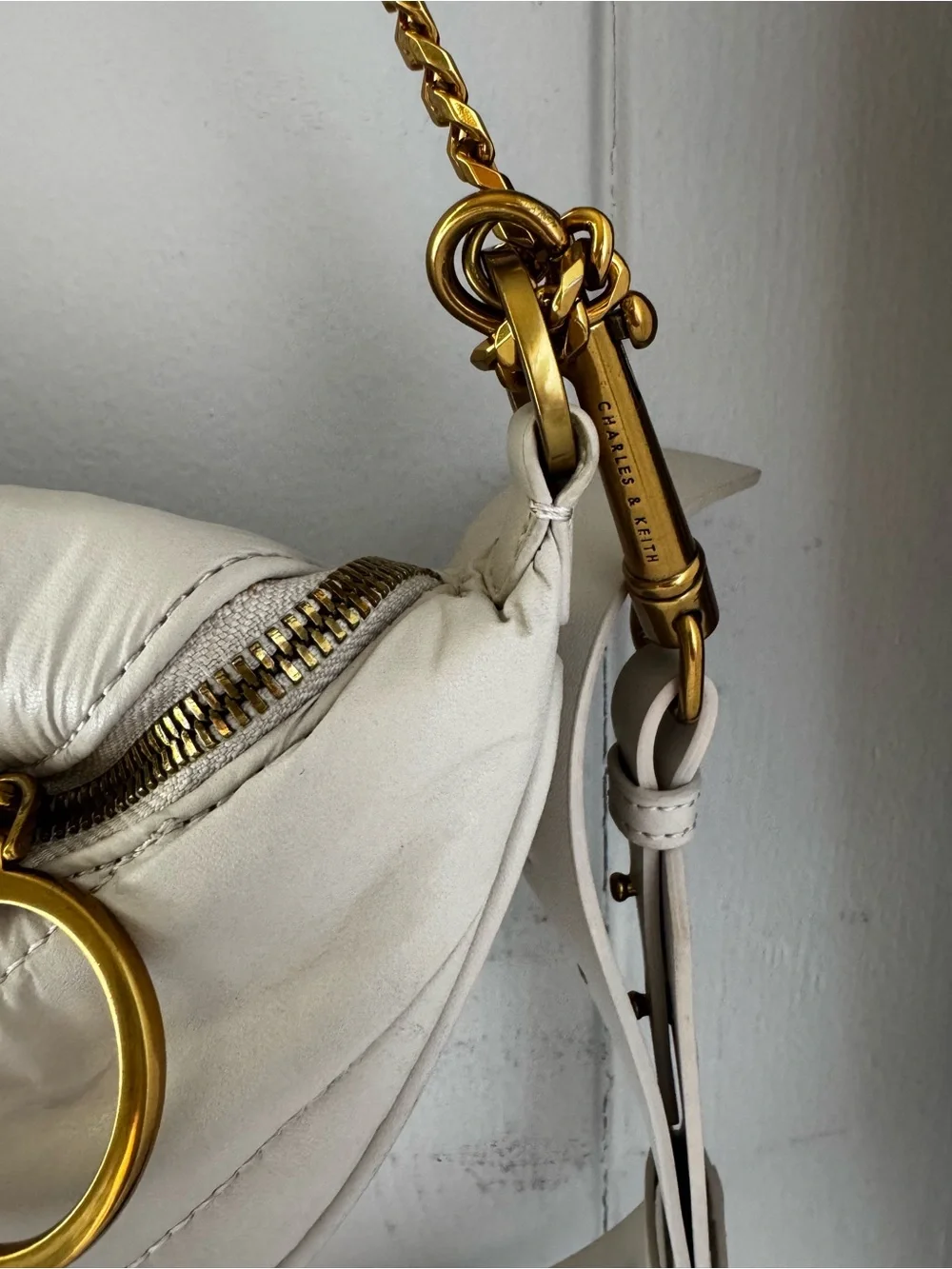 Charles & Keith Minimalist Crescent Crossbody Bag in cream with Gold Chain